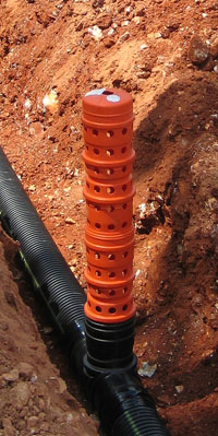 Bright orange hickenbottom inlet connected to drainage system